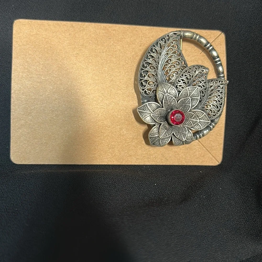 Elegant Silver Floral Brooch with Red Accent